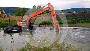 A special floating excavator cleans the canal from the sludge