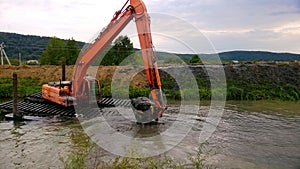 A special floating excavator cleans the canal from the sludge