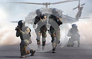 Special force assault team in a mission with helicopter