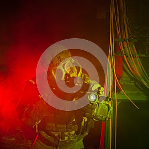 Special forces soldier with gas mask during night mission