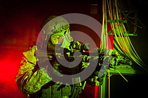 Special forces soldier with gas mask during night mission