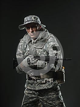 Special forces soldier man with Machine gun on a dark background