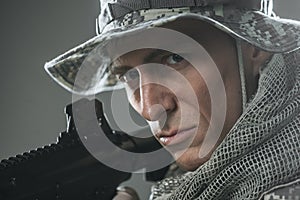 Special forces soldier man with Machine gun on a dark background