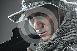 Special forces soldier man with Machine gun on a dark background