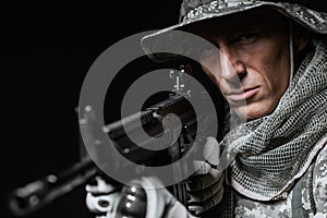 Special forces soldier man with Machine gun on a dark background