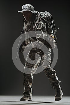 Special forces soldier man with Machine gun on a dark background