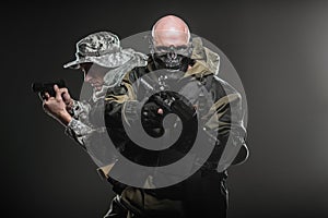 Special forces soldiers men with Machine gun on a dark background