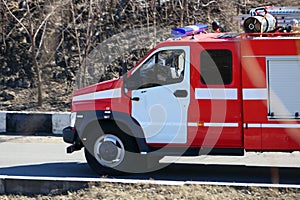 Special freight transport on the road. The fema car or fire service is on the road.