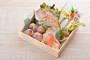 Special gift box with fried snapper fish, broccoli, lettuce and