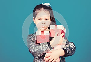 Special happens every day. Girl with gift boxes blue background. Black friday. Shopping day. Child carry lot gift boxes