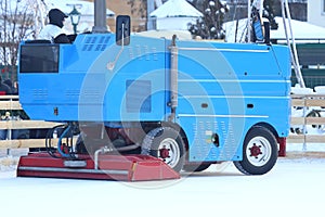 Special machine for cleaning ice on an ice rink at work. Transport industry