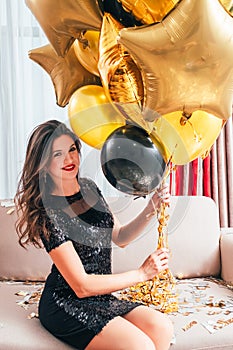 Special occasion happy brunette girl balloons