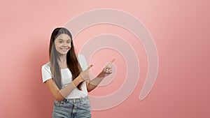 Special Offer. Cheerful Teen Girl Pointing At Copy Space With Two Fingers