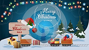 Special offer Christmas sale discount up to fifty percent dark blue banner with discount train carries candy and toy in the snow