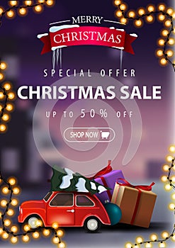Special offer, Christmas sale, up to 50% off, beautiful discount banner with garland and red vintage car carrying Christmas tree