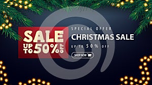 Special offer, Christmas sale, up to 50% off, blue discount banner with red pricetag, garland and frame of Christmas tree branches