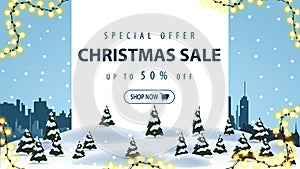 Special offer, Christmas sale, up to 50% off, discount banner with winter landscape and silhouette city on background