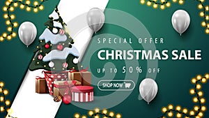 Special offer, Christmas sale, up to 50% off, green discount banner with garland, white balloons, diagonal line and Christmas tree