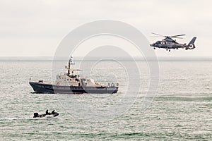 Special operations forces training. Military helicopter over ship