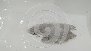 Special powder for blocked sink pipes. Clogged bathroom hole. Drainage cleaning cervices