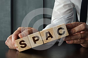 Special purpose acquisition company SPAC is shown using the text on the cubes