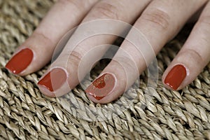 Special red nail lack with shinning parts on one finger photo