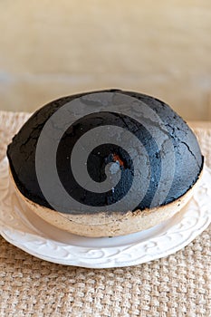 Special round black cake made from eggs and butter in Poitou, France