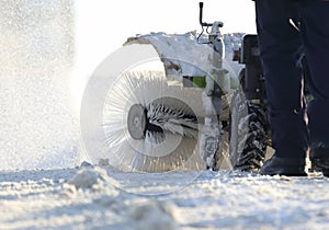 Special snow machine clears snow on the city street