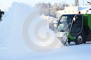 Special snow machine clears snow on the city street