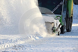 Special snow machine clears snow on the city street