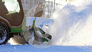 Special snow machine clears snow on the city street