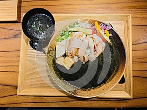 Special spicy Matsusaka pork curry with squid ink and kelp sprout soup