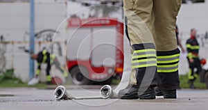 A special team of firefighters seizes hoses from a firetruck and embarks on a perilous mission to extinguish a blazing