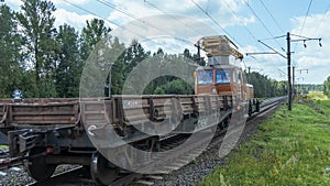 Special train with a landing crane for service and repair of electrical networks on the railway