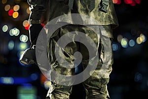 Special unit soldier holds a night vision device in his hand