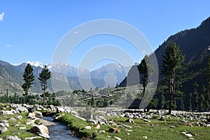 A special view of Kumrat Valley laks and stones among the mountains and trees KP Pakistan