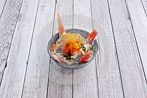 Special wakame salad with surimi sticks, mariner sauce and fish roe