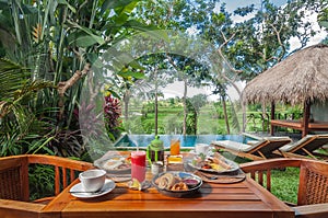 Special Western breakfast menu set on the table outdoor in the garden area