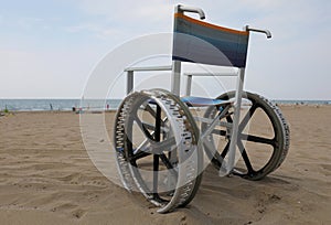 special wheelchair with big wheels on the beach