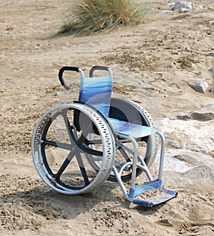 special wheelchair with big wheels on the sand