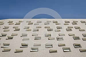 Special windows on a white buidling in Groningen photo