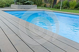 Special wooden board around the swimming pool, texture, background.