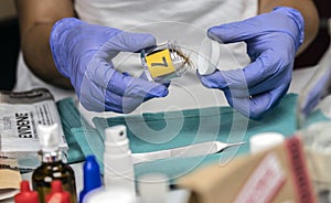 Specialist cop examines hair from crime scene