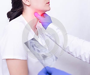 A specialist doctor diagnoses a girl s sore throat by palpating for the presence of inflammation and swelling, sore throat and