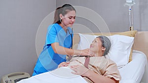 Specialist doctor woman checkup with patient elderly with stethoscope for listening heartbeat in hospital ward.