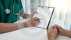 Specialist doctors advise and examine the history of patients in a direct health room at a modern hospital