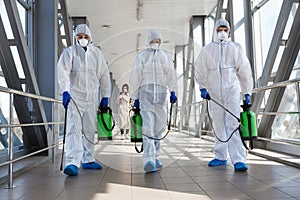 Specialist in hazmat suits cleaning disinfecting coronavirus photo