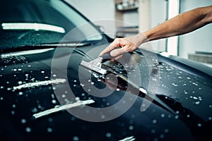 Specialist prepares car for protect against chips