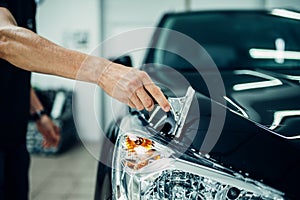 Specialist prepares car for protect against chips