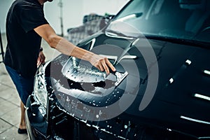 Specialist prepares car for protect against chips